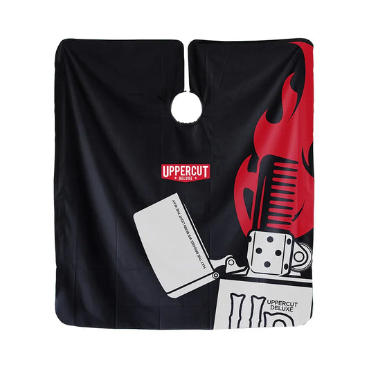 Uppercut Deluxe Barber Cape - Bridge Burner — black barber cape hung flat, Bridge Burner lighter and flame artwork, white background