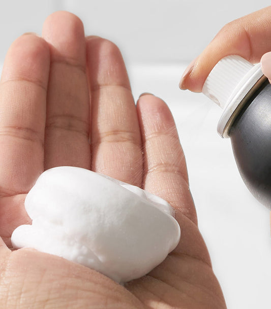 SexyHair Style Curl Power Curl Bounce Mousse — mousse being dispensed from the can into a hand