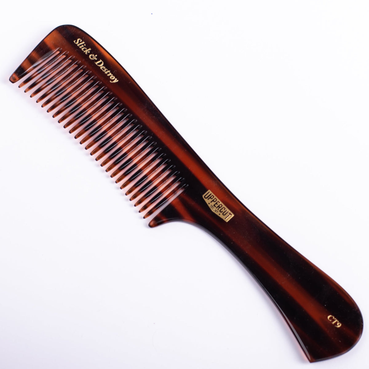 Uppercut Deluxe CT9 Styling Comb — comb on its retail backing card, front, plain white background