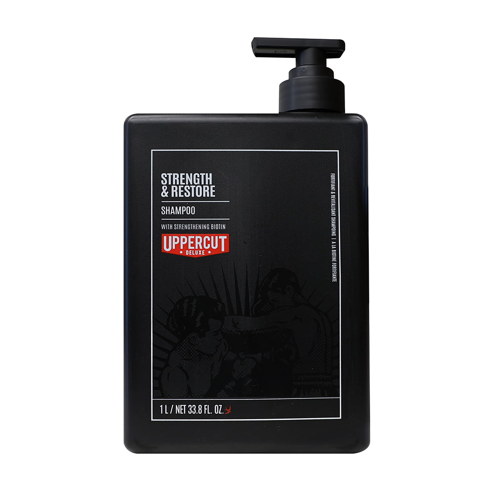 Uppercut Deluxe Strength & Restore Shampoo — 1 L back-bar bottle with pump, front label, plain white background