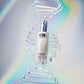 K18 FutureIQ Nightly Biomimetic Scalp Serum — 90 ml dropper bottle, studio shot with glass DNA-helix props