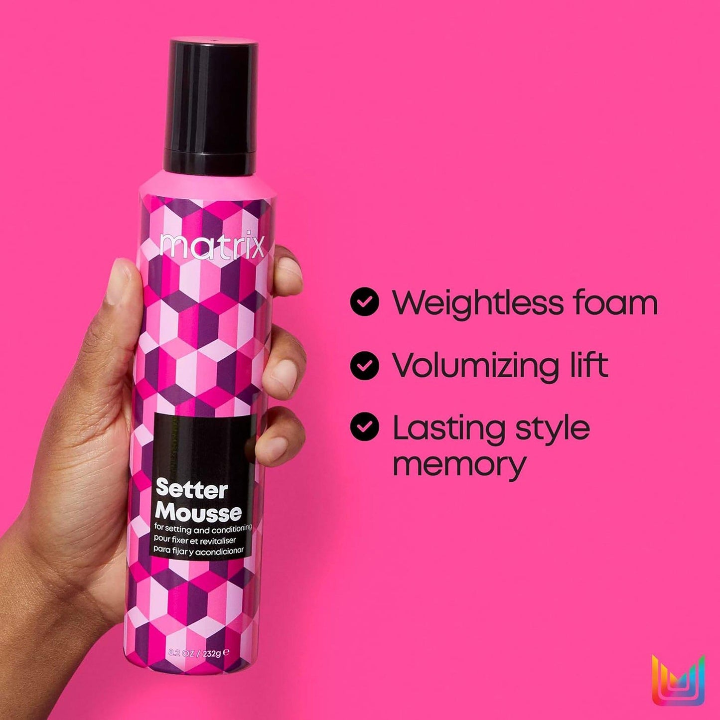 Matrix Setter Mousse — 326 g can held in hand on pink background with the three key benefits listed