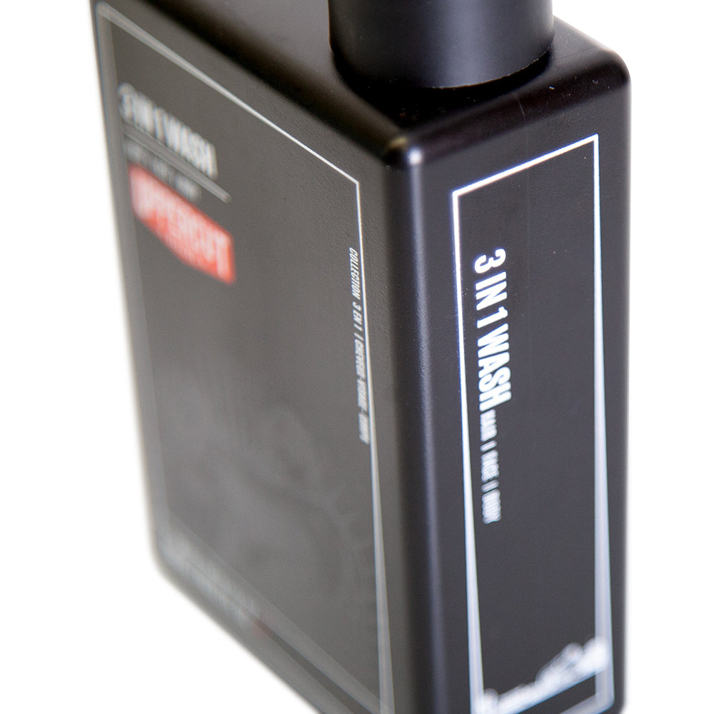 Uppercut Deluxe 3 in 1 Wash 240 ml — black 240 ml bottle, side panel with ingredients, white background