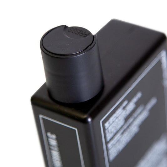 Uppercut Deluxe 3 in 1 Wash 240 ml — close-up of the flip-top cap on the 240 ml bottle