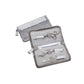 Olivia Garden TextureCut Shear & The Edge Razor Set — silver crocodile-print zip case shown open beside its closed cover, holding a chrome shear with a blade guard, The Edge razor and a ShearCare oil pen in fabric straps, plain white background