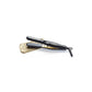 Olivia Garden Travel Flat Iron — small black Ceramic + Ion travel flat iron with narrow plates and a coiled black cord, resting on a gold scroll-patterned heat-resistant travel mat, angled view on plain white