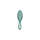 Olivia Garden Holiday Shine care and style brush in turquoise, on a plain white background