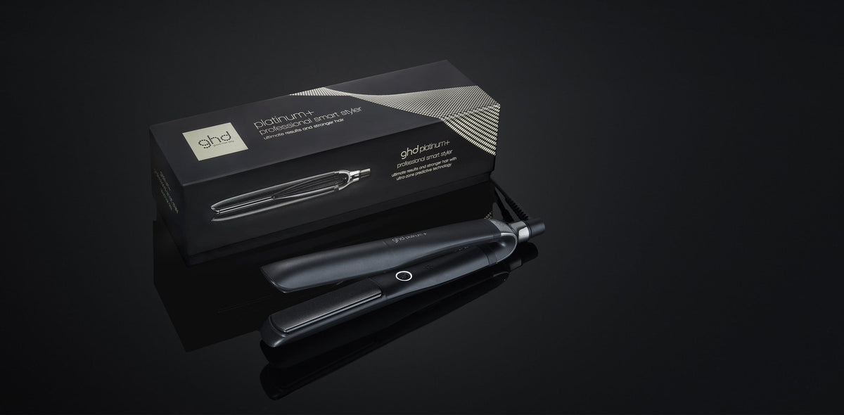 GHD Platinum+ black hair straightener with its box