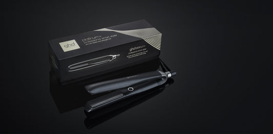 GHD Platinum+ black hair straightener with its box