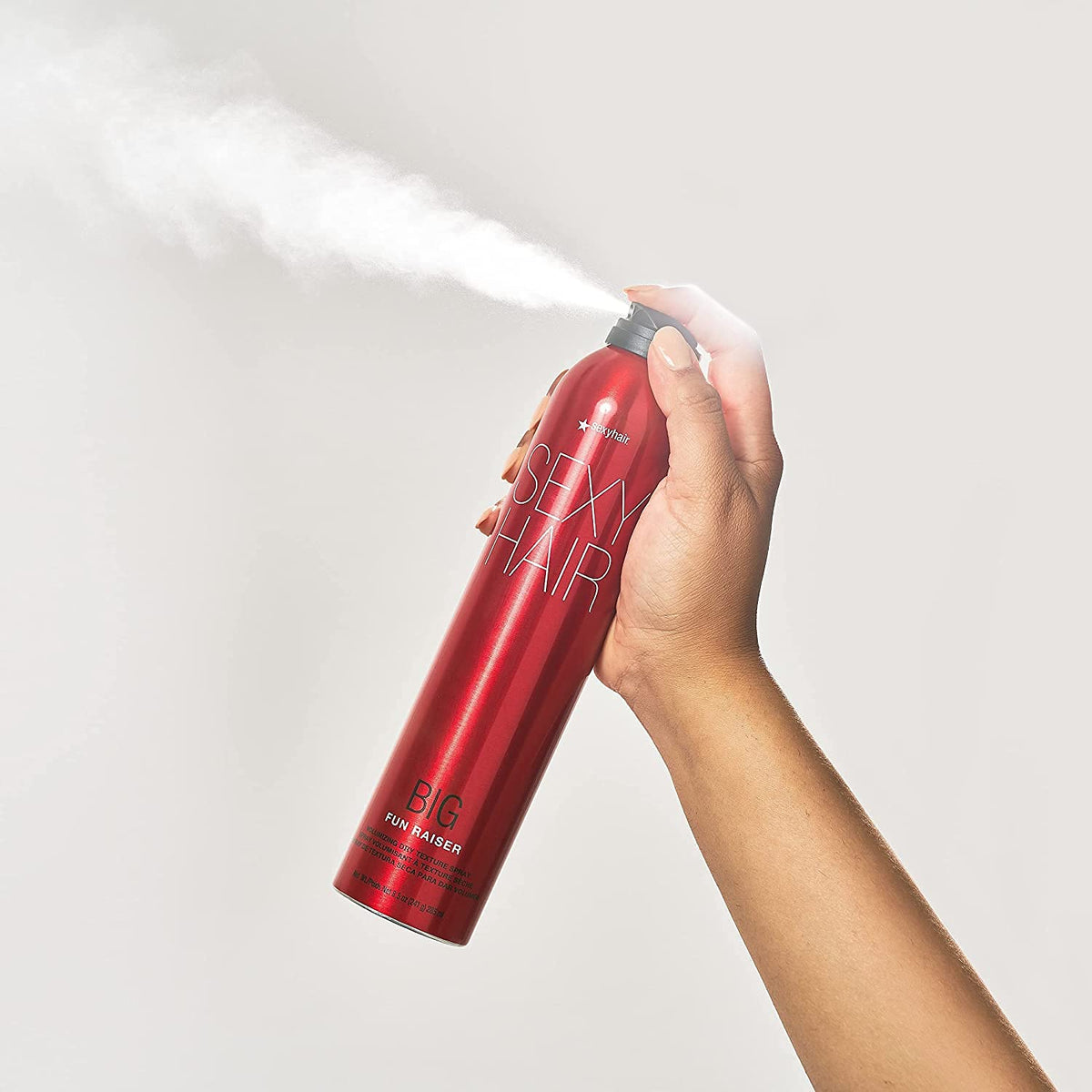 SexyHair Big Fun Raiser Volumizing Dry Texture Spray — can being sprayed, showing the dry texture mist