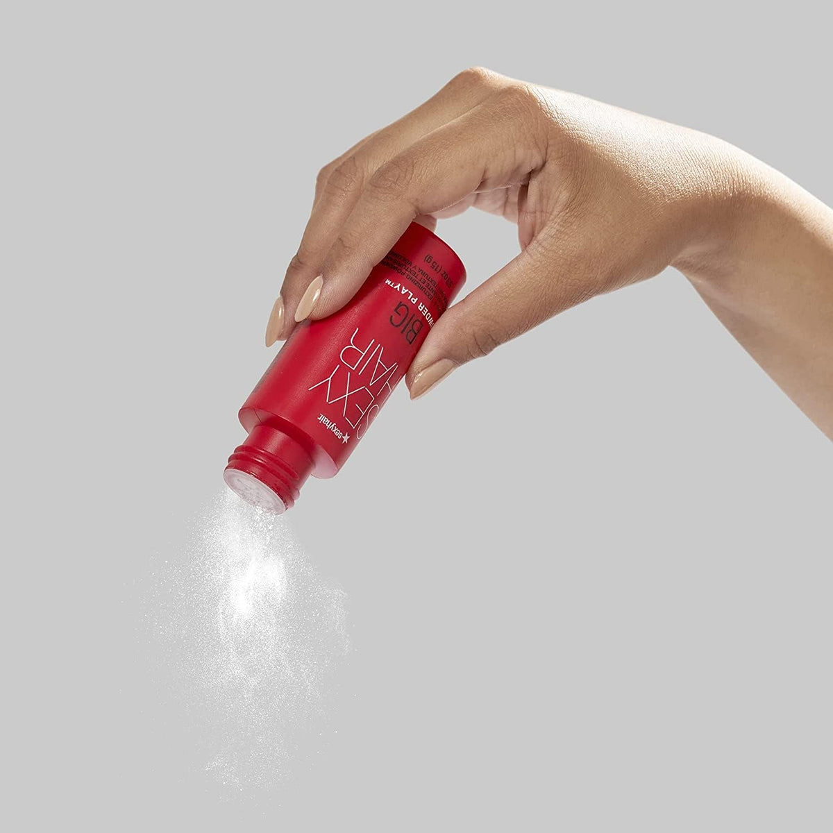 SexyHair Big Powder Play Volumizing & Texturizing Powder — powder being dispensed from the bottle into a hand