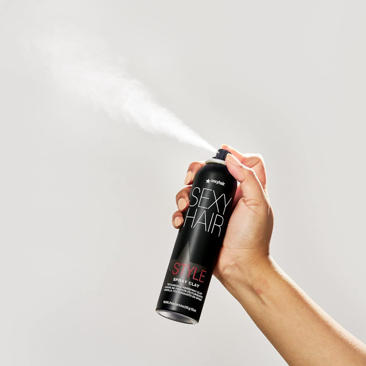 SexyHair Style Spray Clay Texturizing Hairspray Clay — can being sprayed, showing the mist