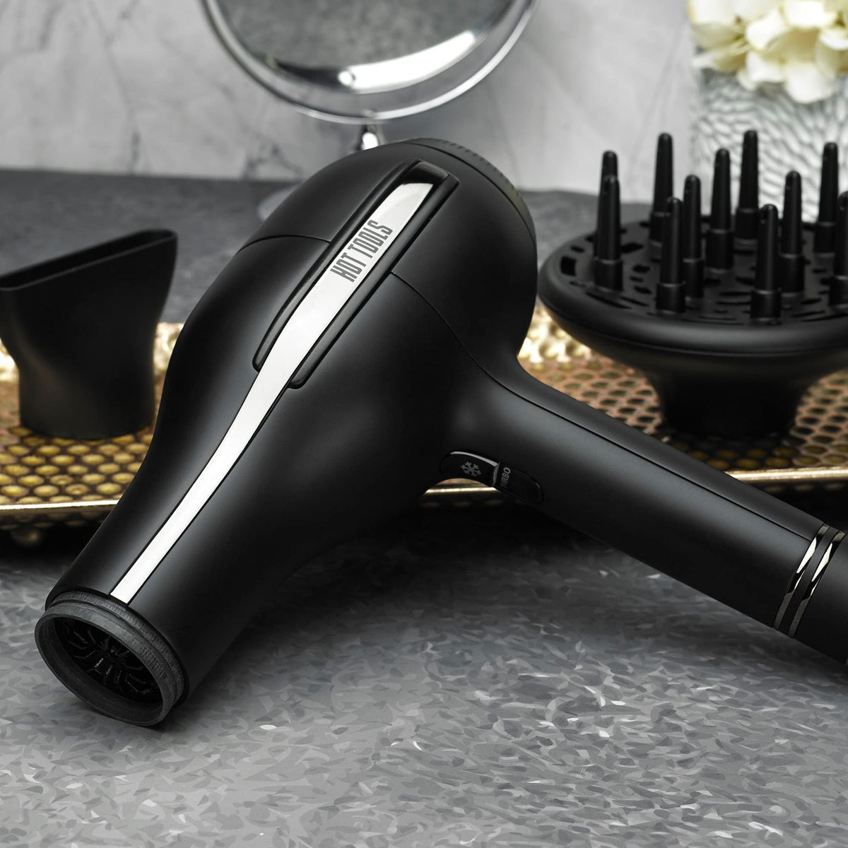 Hot Tools Black Gold Pro ionic salon dryer shown with its diffuser attachment