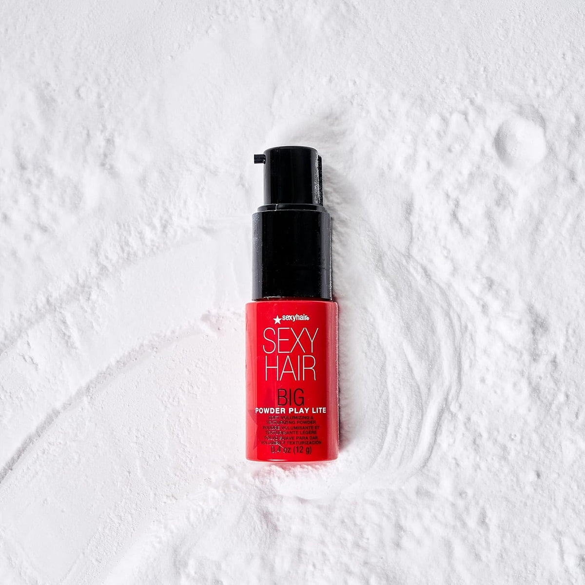 SexyHair Big Powder Play Lite Soft Volumizing & Texturizing Powder — pump bottle lying on loose powder