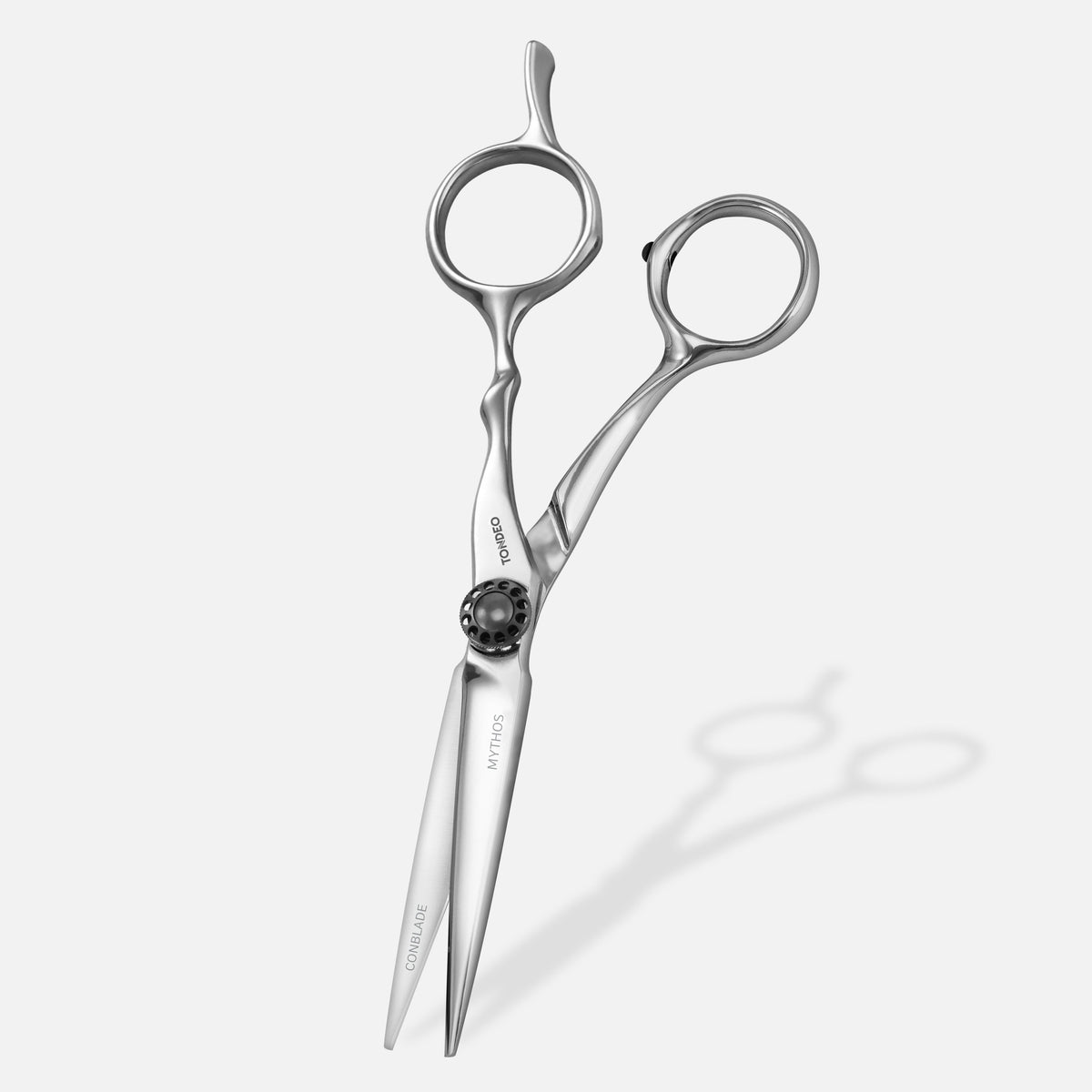 Tondeo Mythos 5.5-inch offset haircutting scissors, silver, standing view with dial tension screw