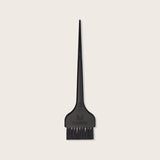Matrix Color Brush — slim black plastic salon tint applicator brush with a long pointed sectioning tail and the Matrix mark on the handle, shown on a plain background