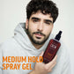 American Crew Medium Hold Spray Gel 250ml — model in a grey hoodie holding the 250 ml Medium Hold Spray Gel bottle