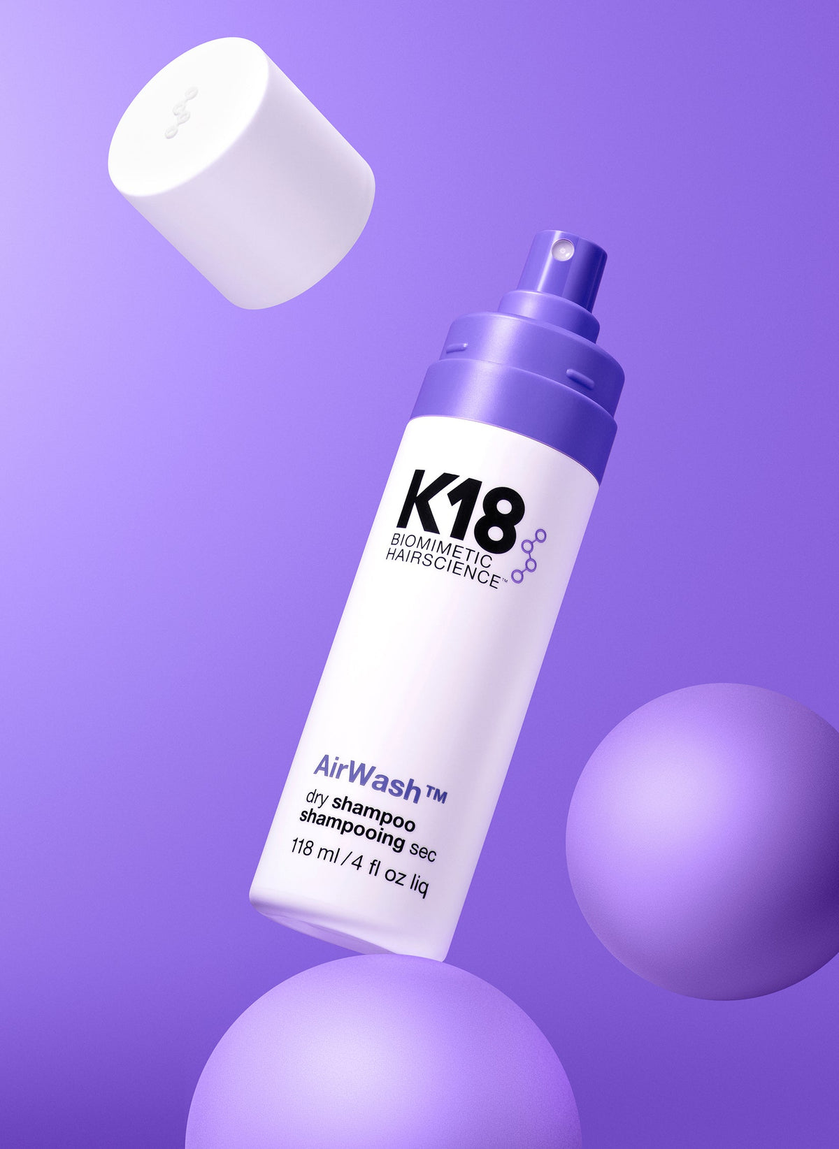 K18 AirWash Non-Aerosol Dry Shampoo — 4 oz bottle with cap removed, floating studio shot