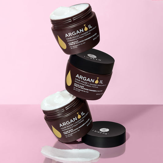 Luseta Beauty Argan Oil Hair Mask — three 16.9 fl oz / 500 ml jars stacked on a pink background, front label