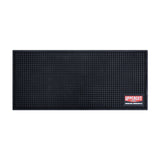 Uppercut Deluxe Barber Station Mat — black studded non-slip counter mat with the red Uppercut Deluxe Grooming Supply Co. badge, plain white background
