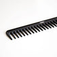 Uppercut Deluxe CB11 Rake Comb — black rake comb angled, showing the tooth spacing