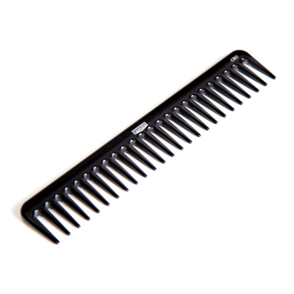 Uppercut Deluxe CB11 Rake Comb — black rake comb from above at an angle, white background