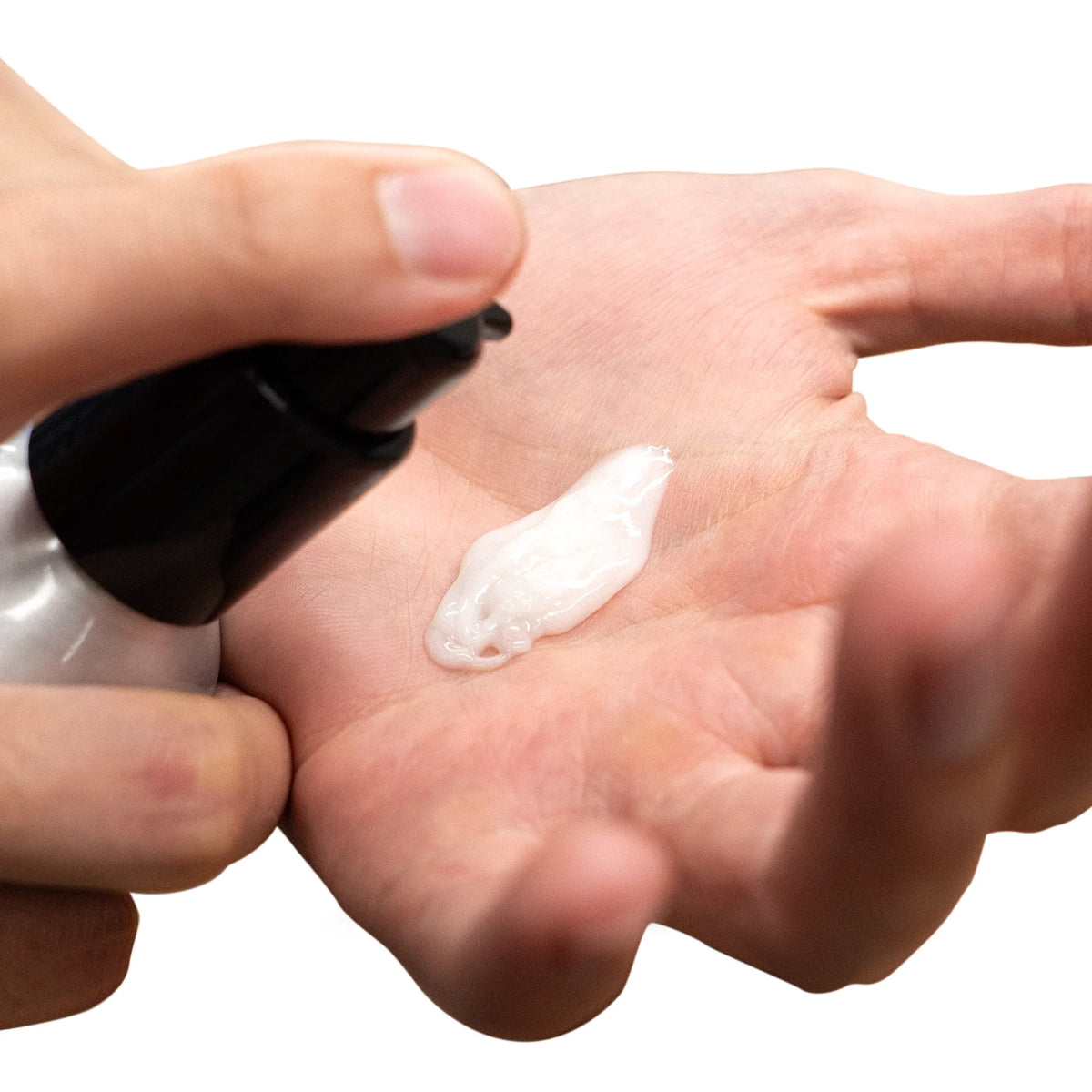 Uppercut Deluxe Control Cream 120 ml — control cream dispensed into a palm, showing the cream texture