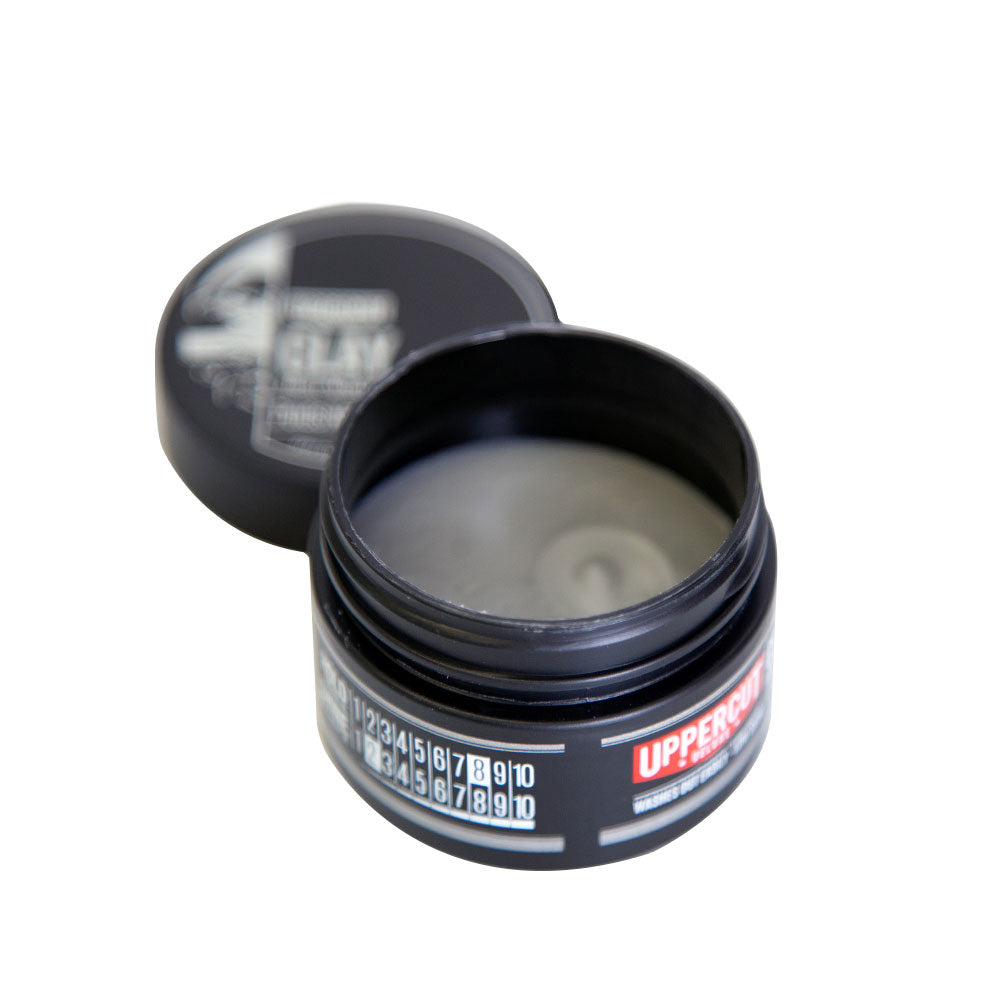 Uppercut Deluxe Clay Pomade — 25 g midi tin open showing the clay