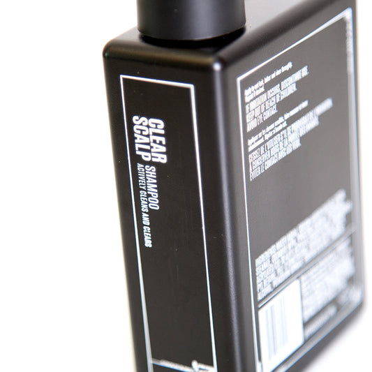 Uppercut Deluxe Clear Scalp Shampoo 240 ml — black 240 ml shampoo bottle, side panel with ingredients