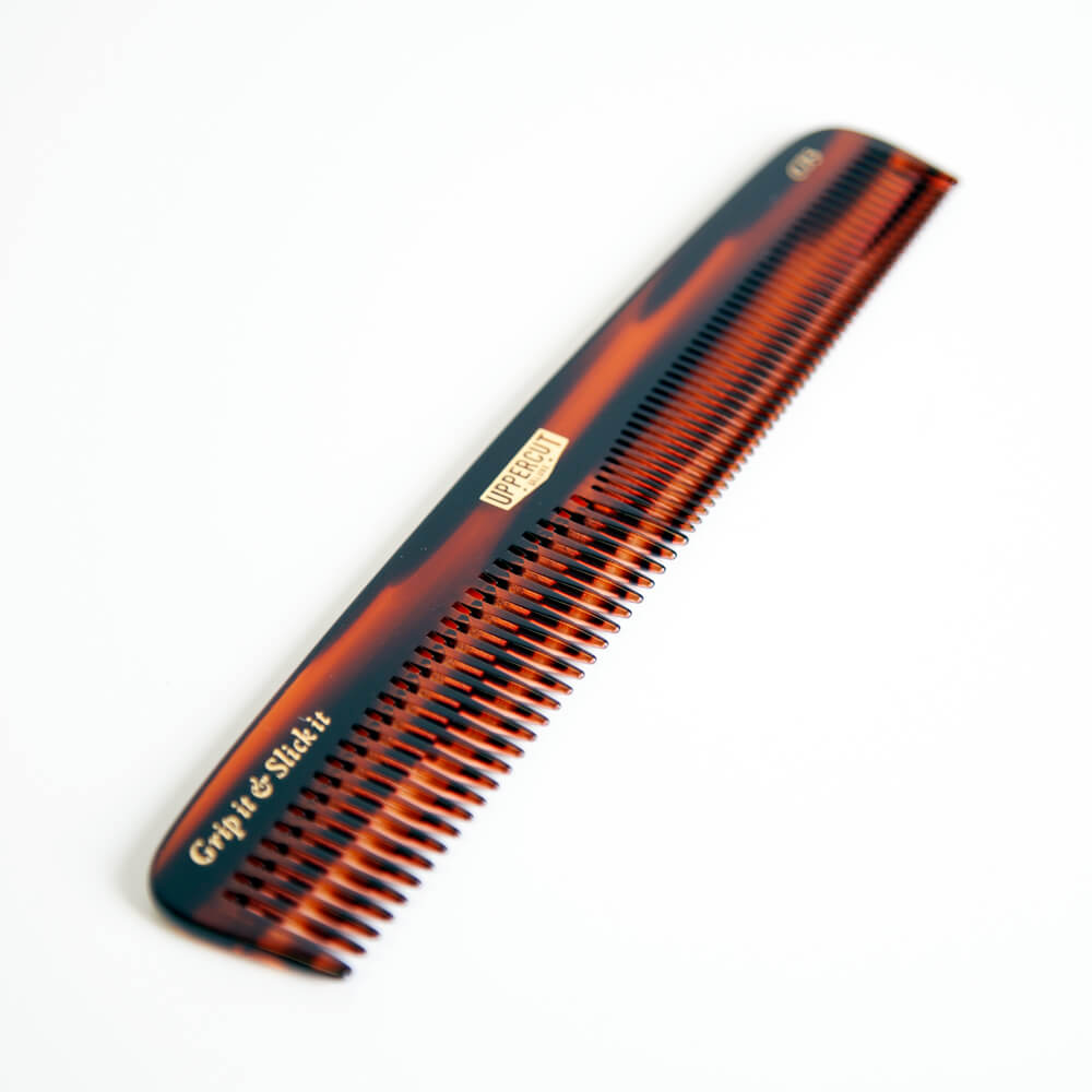 Uppercut Deluxe CT5 Tortoise Shell Comb — comb angled showing the fine and wide tooth sections