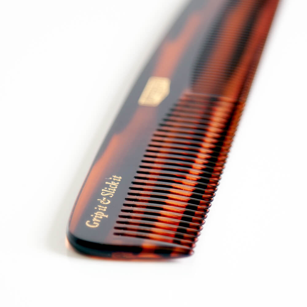 Uppercut Deluxe CT5 Tortoise Shell Comb — close-up of the tortoise-shell finish and gold badge