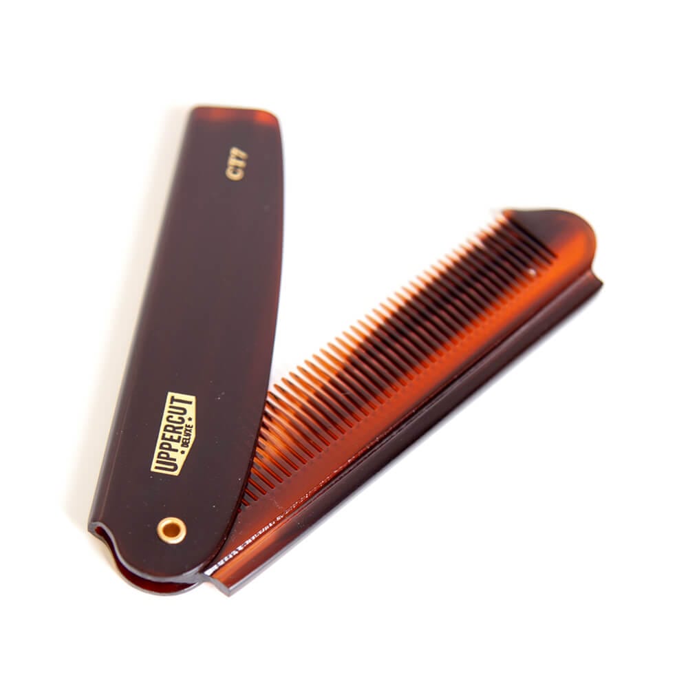 Uppercut Deluxe CT7 Flip Comb — tortoiseshell flip comb opened at an angle, white background
