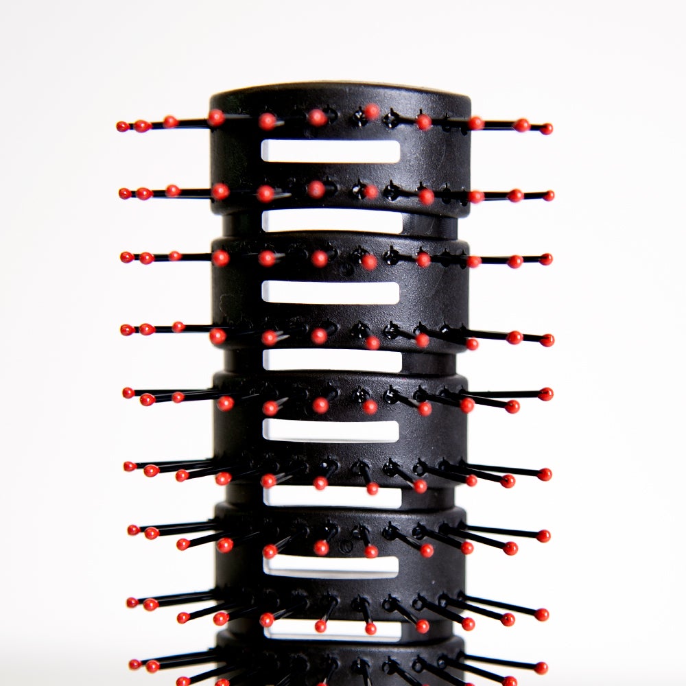Uppercut Deluxe Vent Brush — close-up of the vented body and ball-tip bristles