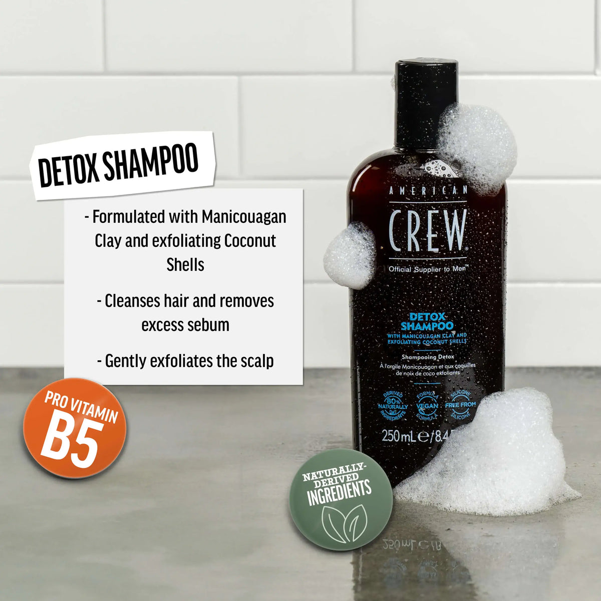 American Crew Detox Shampoo — 250 ml bottle in lather beside a card listing Manicouagan clay, coconut shells and Pro Vitamin B5