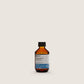 Insight Energizing Shampoo 100ml — official brand packshot of the current 100 ml package, amber bottle, front label facing camera, warm beige background