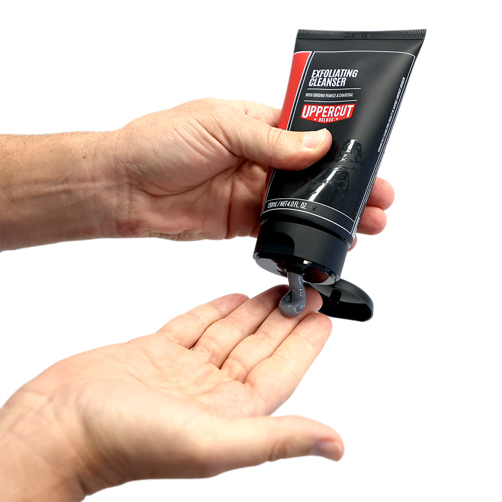 Uppercut Deluxe Exfoliating Cleanser 120 ml — cleanser squeezed into a palm, showing the exfoliating texture