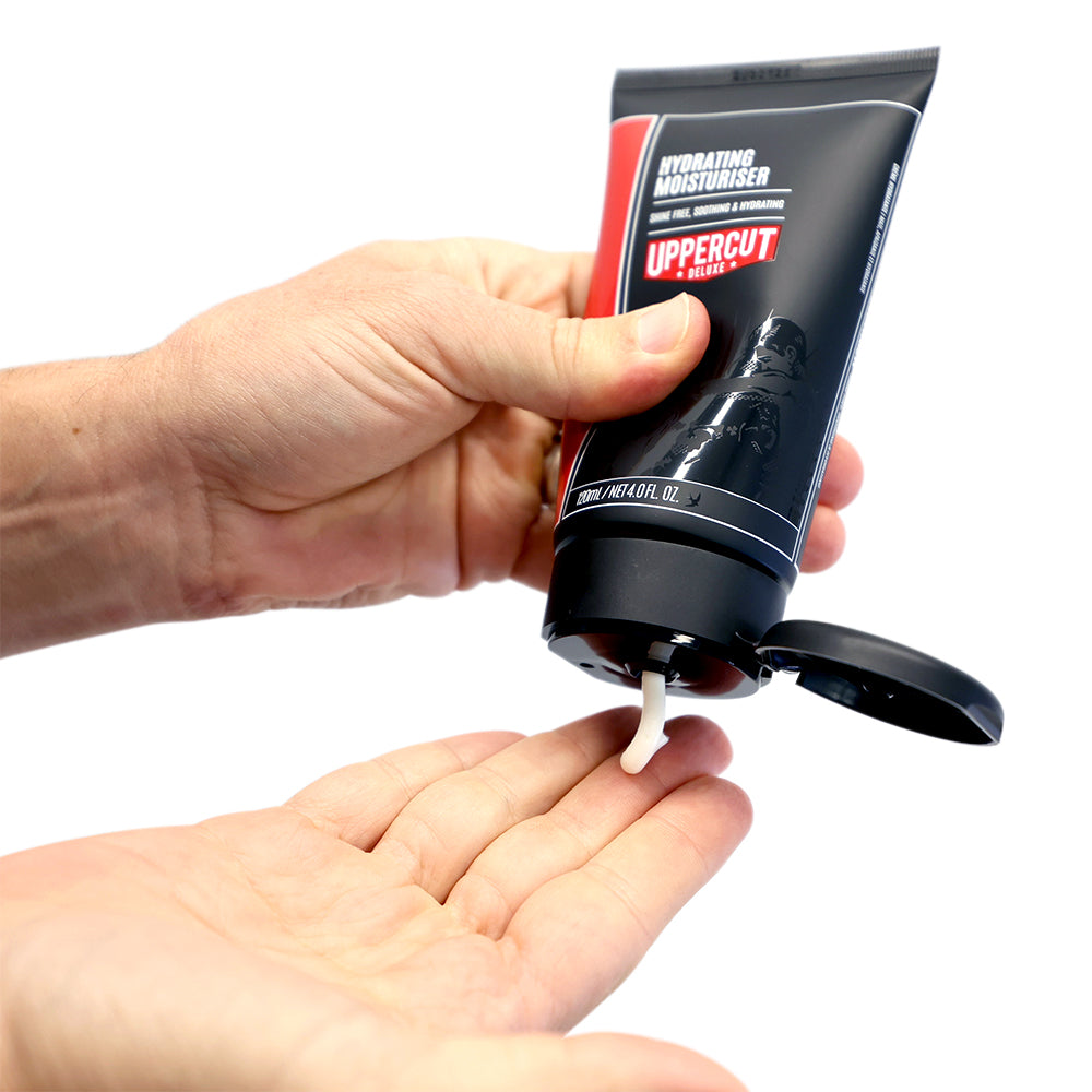 Uppercut Deluxe Hydrating Moisturiser 120 ml — moisturiser squeezed into a palm, showing the cream texture