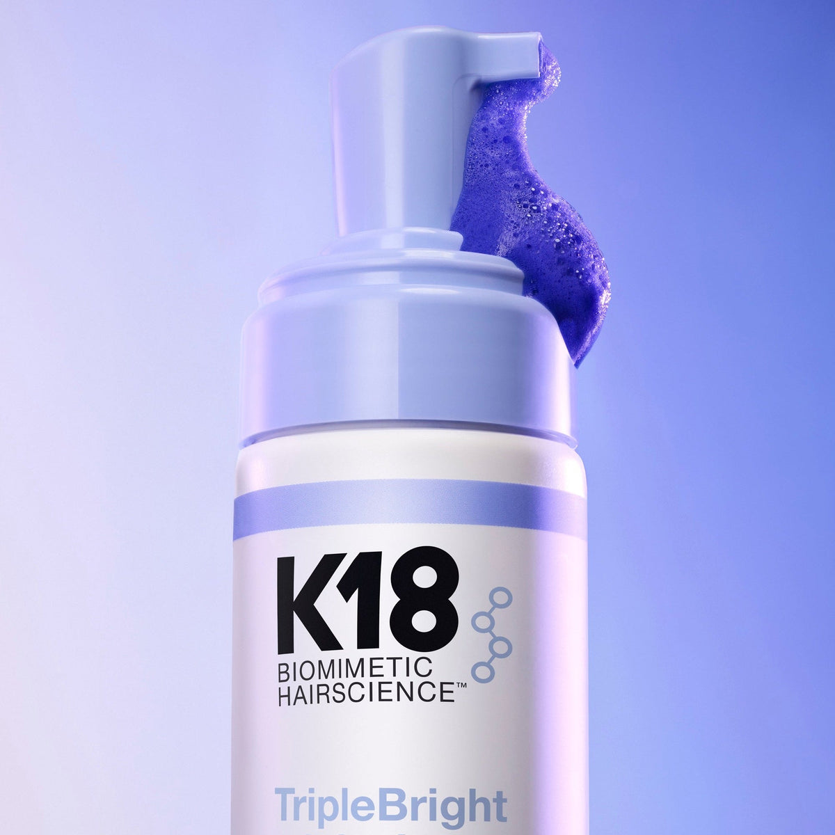 K18 TripleBright Purple Shampoo — close-up of the purple foam texture at the pump