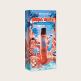 Matrix Mega Sleek Holiday Kit 2026 — blue beach-and-candy gift carton with the orange Mega Sleek bottle standing in front of it
