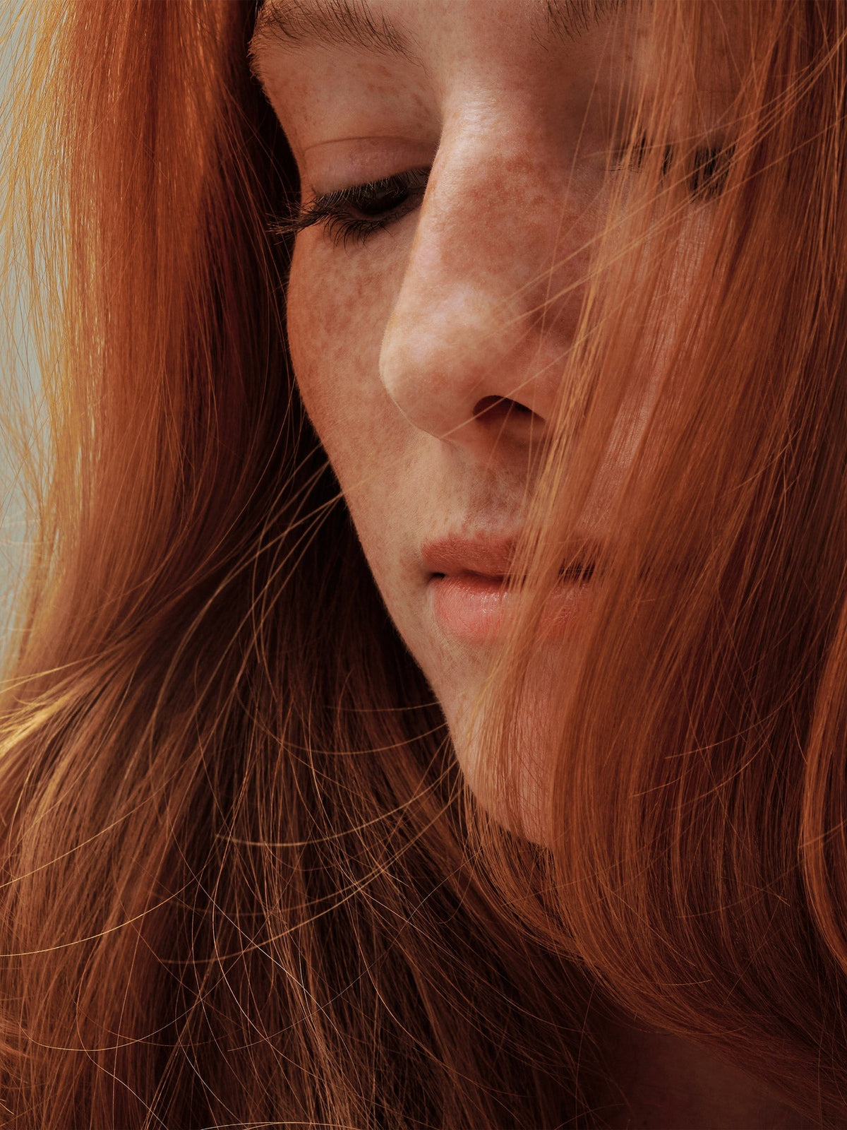 AG Care Colour Savour — model with long red colour-treated hair