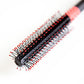 Uppercut Deluxe Quiff Roller Brush — close-up of the red ball-tip bristles
