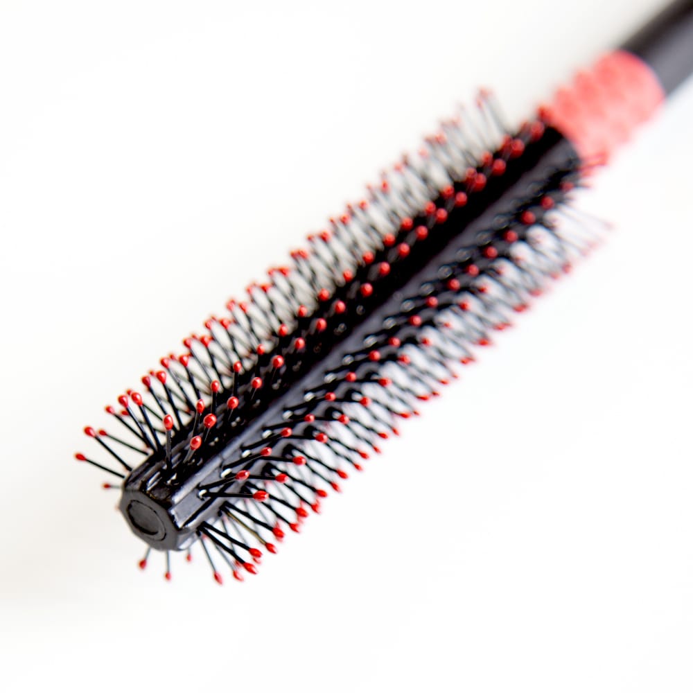 Uppercut Deluxe Quiff Roller Brush — close-up of the red ball-tip bristles