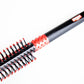 Uppercut Deluxe Quiff Roller Brush — close-up of the rubber non-slip grip handle
