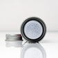 Uppercut Deluxe Styling Powder — 20 g tin with the shaker cap removed, showing the sifter
