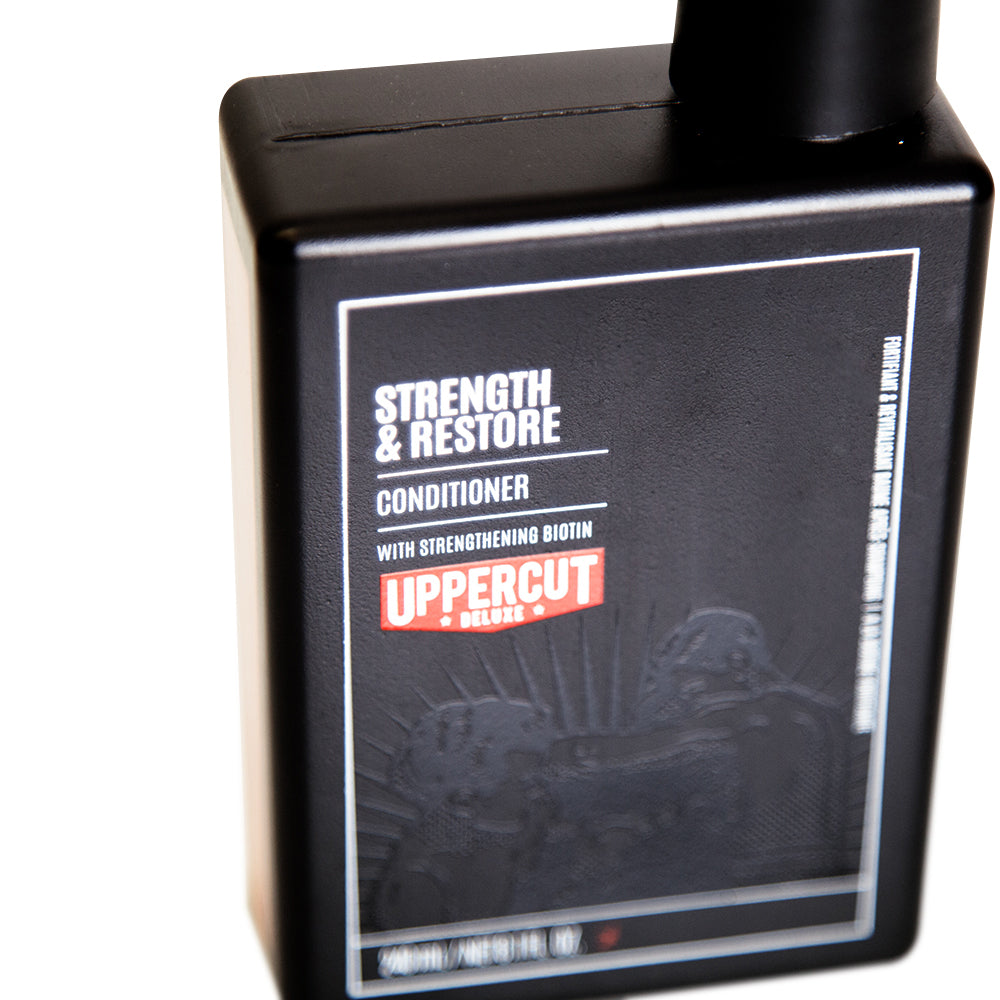 Uppercut Deluxe Strength & Restore Conditioner — 240 ml bottle angled, front label detail