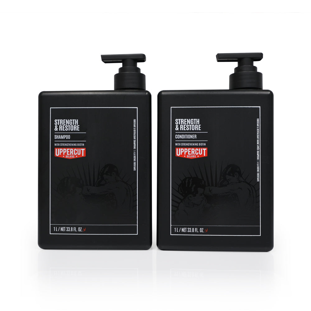 Uppercut Deluxe Strength & Restore Duo — back-bar pair, the 1 L shampoo beside the 1 L conditioner with pumps, plain white background