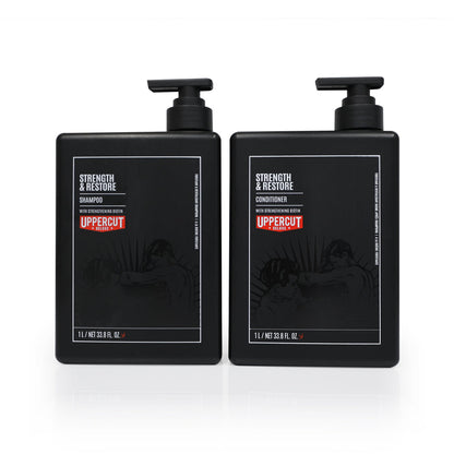 Uppercut Deluxe Strength & Restore Duo — back-bar pair, the 1 L shampoo beside the 1 L conditioner with pumps, plain white background