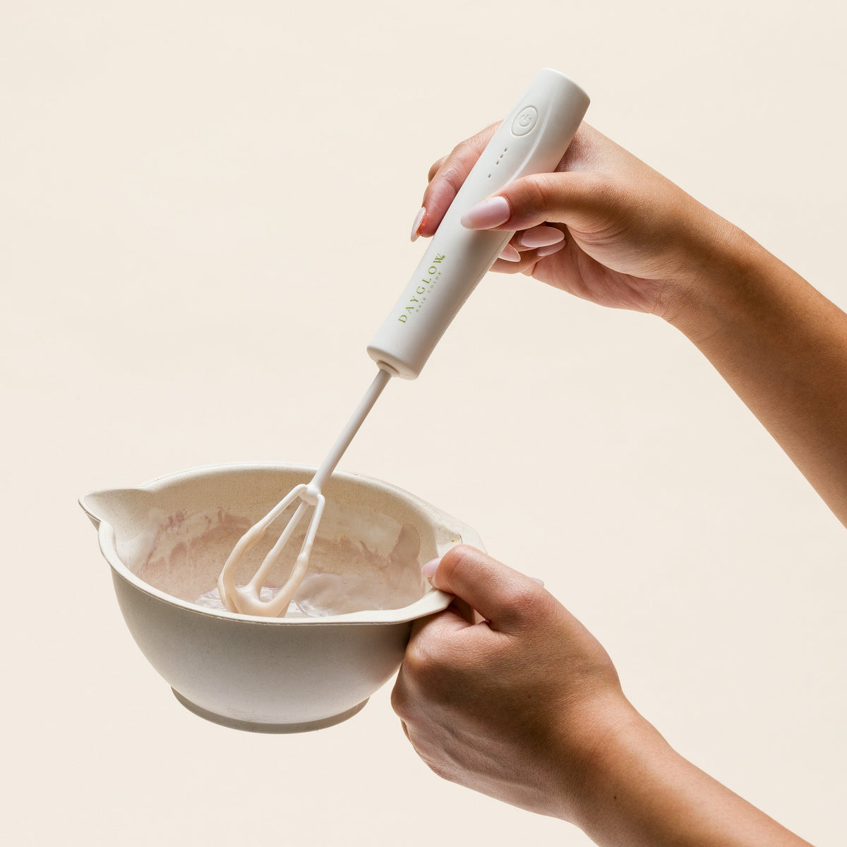 Dayglow electric colour whisk mixing cream colour in a bowl
