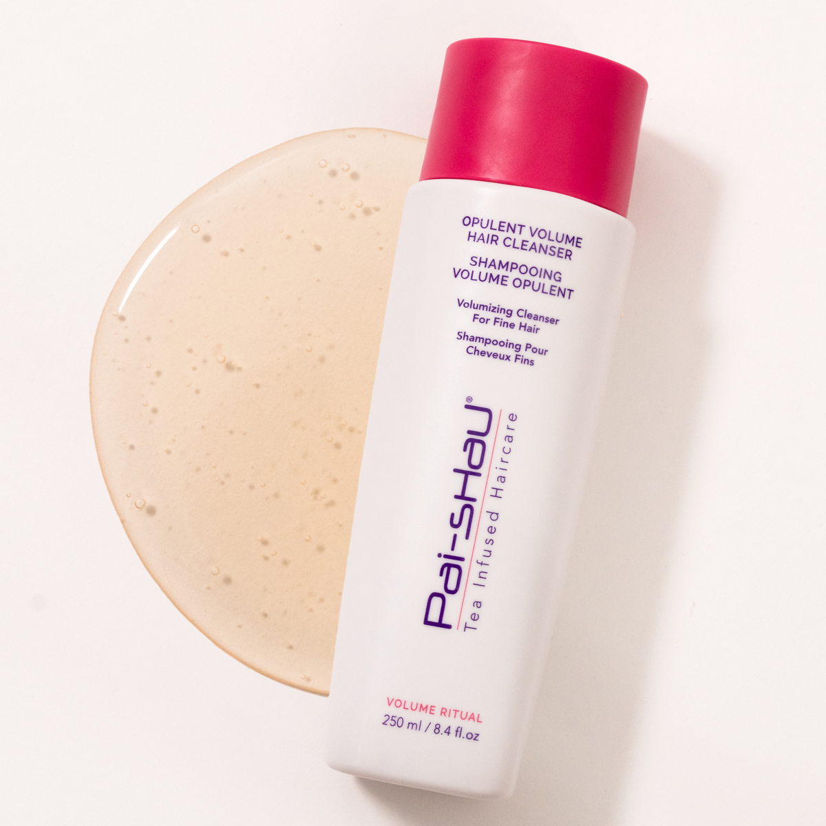 Pai-Shau Volumizing Shampoo — new-livery white 250 ml bottle on a shampoo swatch