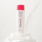 Pai-Shau Volumizing Shampoo — new-livery white 250 ml bottle on a stone plinth against marble